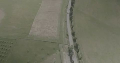 White Car Driving Through Tuscan Countryside in Italy Stock-Footage 343933041