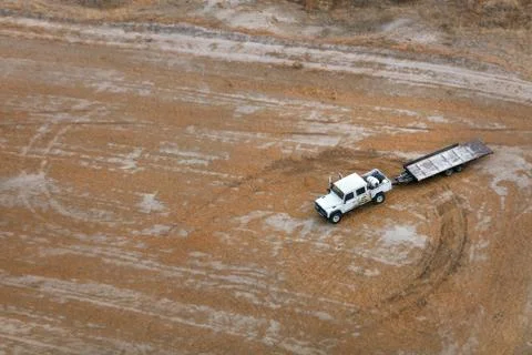 White Car With Empty Trailer At Field Aerial View Stock Photos