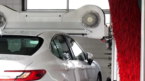 White Car Entering an Automatic Car Wash Stock Footage 346482492