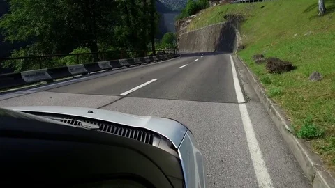 The white car goes down the serpentine. Shooting from first person. Stock Footage 82402531