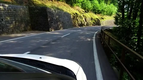 The white car goes down the serpentine. Shooting from first person. Stock Footage 82402710