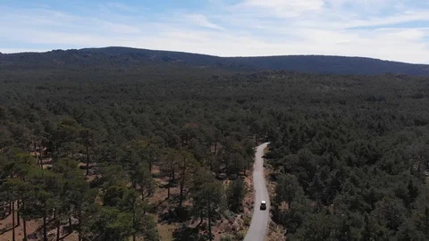 White car on a mountain road Stock Footage 124843868