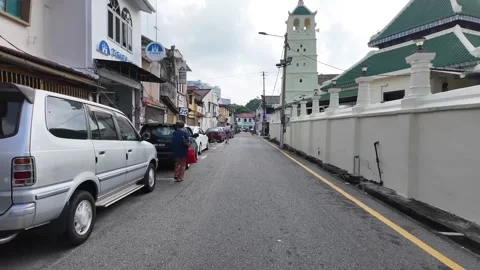 A white car is parked on the side of the road Stock-Footage 315547199