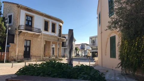 White Car Pass by Town's Square with Classic Buildings Stock Footage 102229225