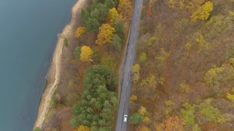 White car speeding on empty aspahlt road, top view Stock Footage 119599499