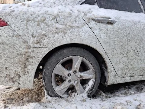 White car is splashed with mud from the road. The whole car is dirty Fotos de archivo