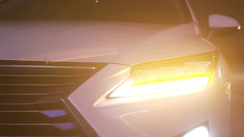 White car stands at night and turned on turn signals Stock Footage 125004430