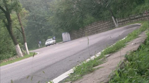 White car turning Stock Footage 235278253