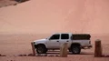 White car in Wadi Rum desert, Hashemite Kingdom of Jordan HD Footage