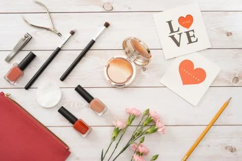 White card with a pattern in the form of heart, Manicure set and nail polish 写真素材