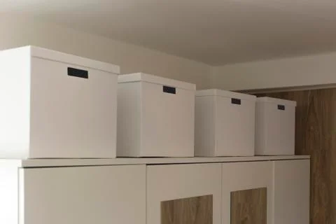 White cardboard boxes as a storage element in the interior Stock Photos