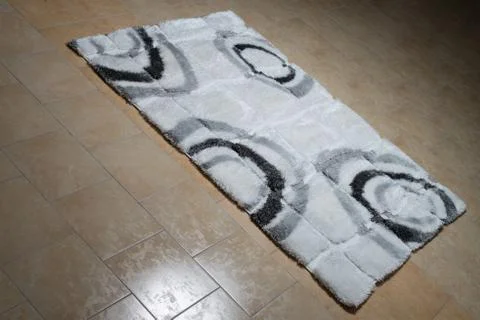 White carpet lying on floor Stock Photos