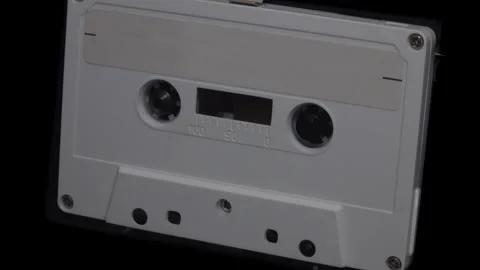 White Cassette Tape with Blank Label Playing Up Close at an Angle Video stock 314917171
