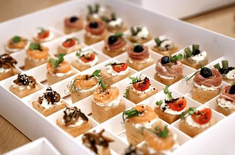 White catering box with assorted savory appetizer Stock Photos