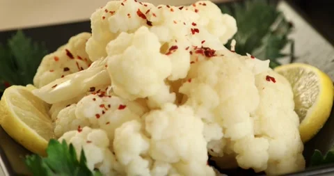 White cauliflower salad rotating on a plate 1 Stock Footage 141991653