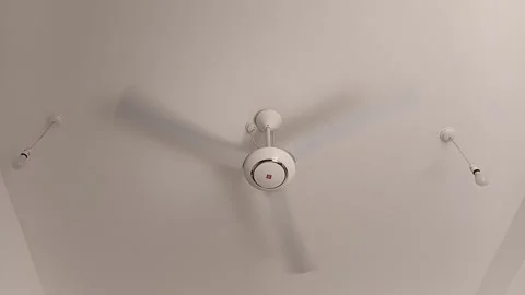 White Ceiling Fan Rotating on Ceiling. Video stock 325795780