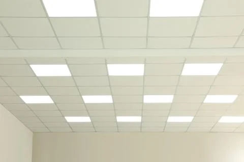 White ceiling with lighting in office room Stock Photos