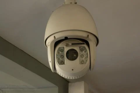 White ceiling security camera Фото