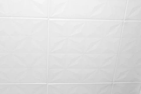 White ceiling tiles made of expanded polystyrene. Stock Photos