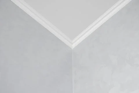 White ceiling with a white plinth in a room with gray painted walls. Decoration Stock Photos
