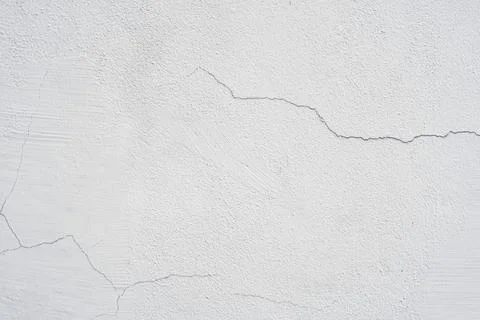 White cement wall background with line cracks for display advertising backdro Stock Photos