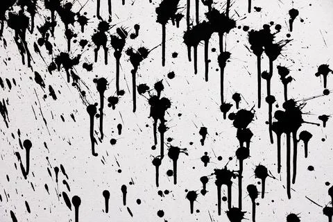 White cement wall with black splashes of white paint. rough surface texture Stock Photos