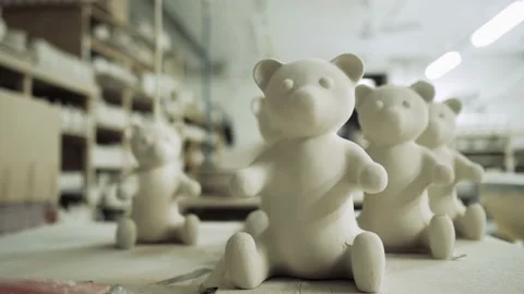 White ceramic bears are on the table in the production shop Stock Footage 158744497