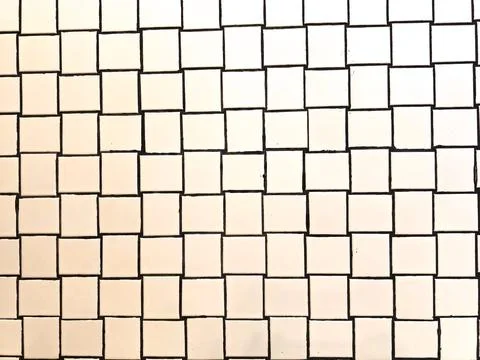 White ceramic brick tile wall with unique pattern. Stock Photos