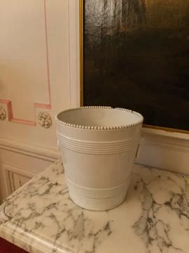 White ceramic bucket on marble Фото
