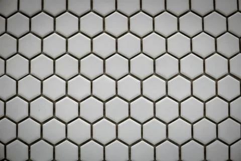 White ceramic cells on the wall as background Stock Photos