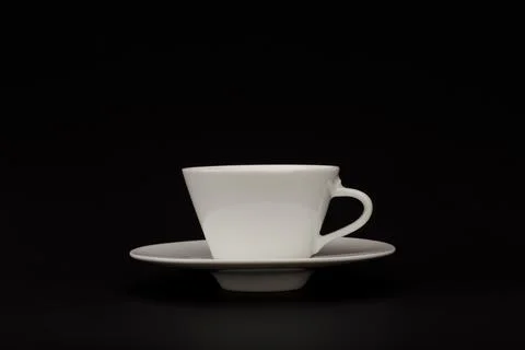 White ceramic coffee cup against black background with copy space Stock Photos