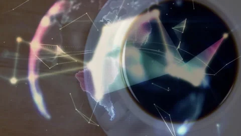 White ceramic coffee cup being overlaid by spinning flat design digital globe on Stock Footage 307445602