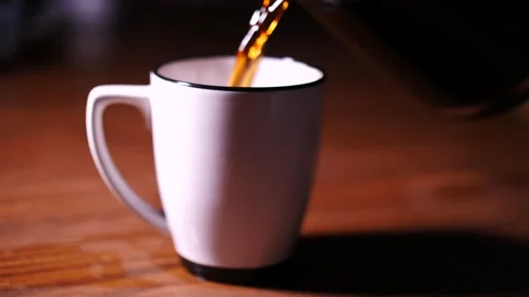 White ceramic coffee mug being filled with hot coffee Stock Footage 153667467