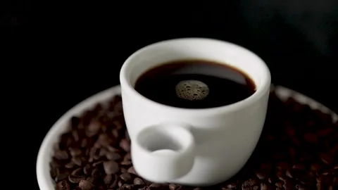 White Ceramic Cup of Black Coffee for Highlighting Health Benefits and Natural E Stock Footage 309144788