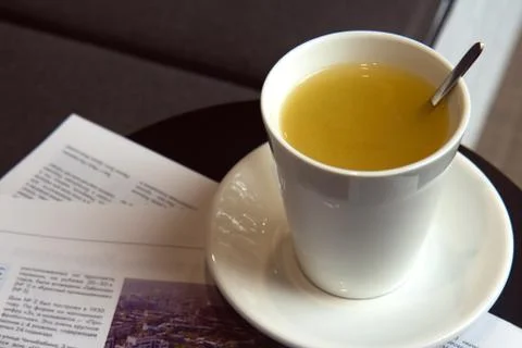 White ceramic cup with ginger tea on a table in a cafe Stock Photos