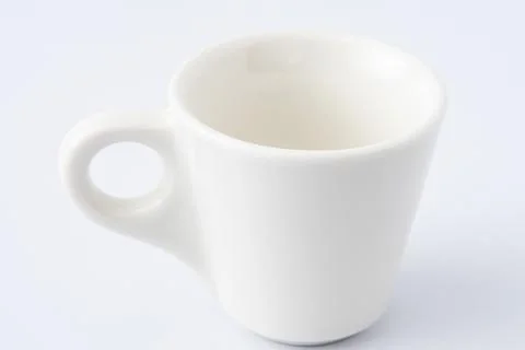 White Ceramic Espresso Cup on White Background. Italian mug for coffee Stock Photos