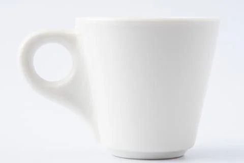 White Ceramic Espresso Cup on White Background. Italian mug for coffee Stock Photos