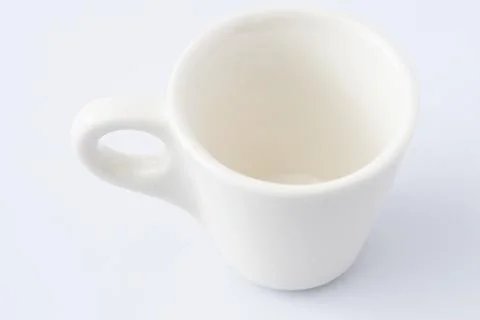 White Ceramic Espresso Cup on White Background. Italian mug for coffee Stock Photos