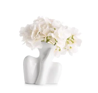 White ceramic human torso vase with artificial hydrangea flowers, modern home Stock Photos