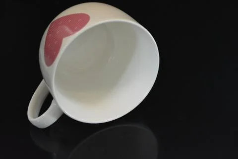 White ceramic kitchen large cup, basin with pink heart and reflection Stock Photos