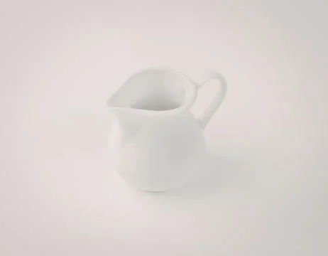 White ceramic milk pitcher with handle Photos