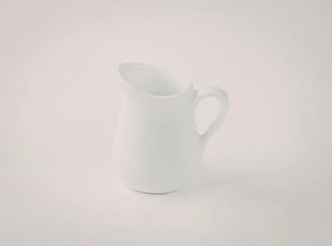 White ceramic milk pitcher with handle Photos