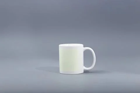 White ceramic mug on gray background for coffee or tea Stock Photos