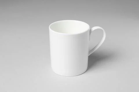 White ceramic mug on light grey background Foto stock