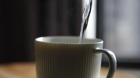 White Ceramic Mug with Vertical Ribbed Texture and Matte Finish 4K Stock-Footage 332158771