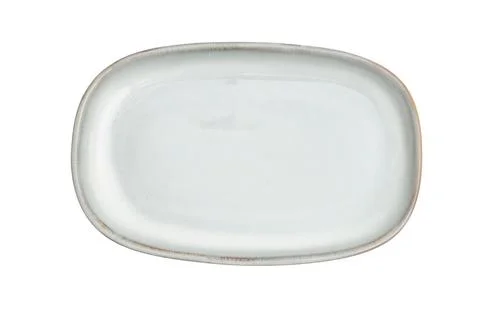 White ceramic oval plate isolated on white background. Empty dish for food .. Stock Photos
