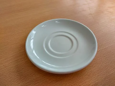 White ceramic plate on the table Stock Photos