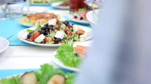 White ceramic plates are filled with delicious food Stock Footage 66169660