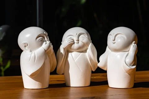The white ceramic statue of three little monk See, Hear, Speak no evil set .. Stock Photos