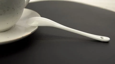 White Ceramic Tea Set with Spoon on Black Tray Stock Footage 268111667